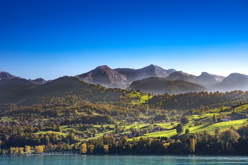 Breathtaking landscape of Spiez with Swiss Alps and Lake Thun in the backdrop. Ideal for nature enthusiasts.